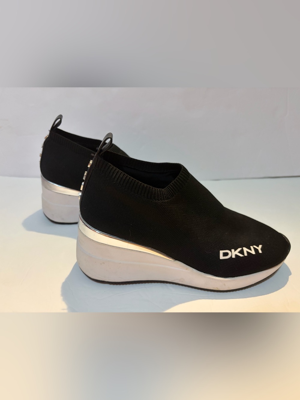 DKNY Black Knit Slip-On Wedge Sneakers with Silver Accent